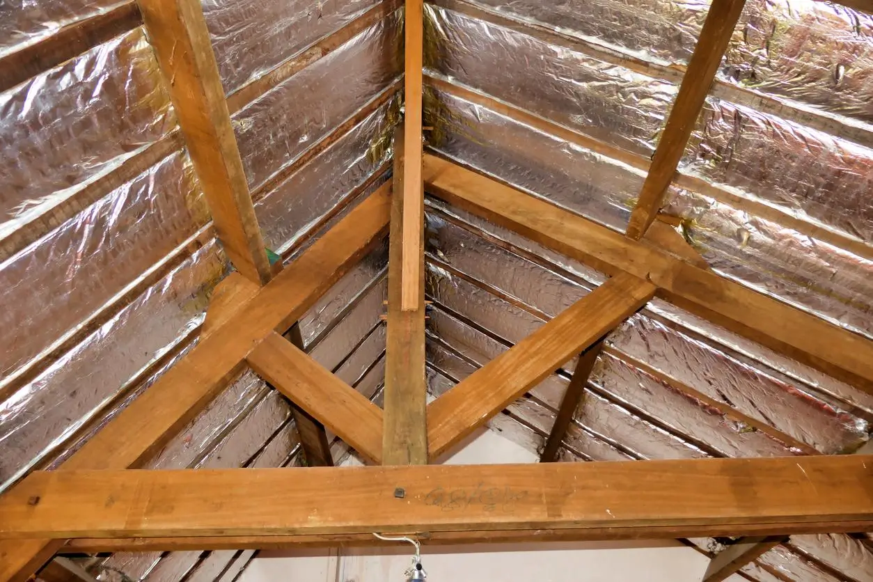 Rigid PIR insulation boards fitted between loft rafters Enfield